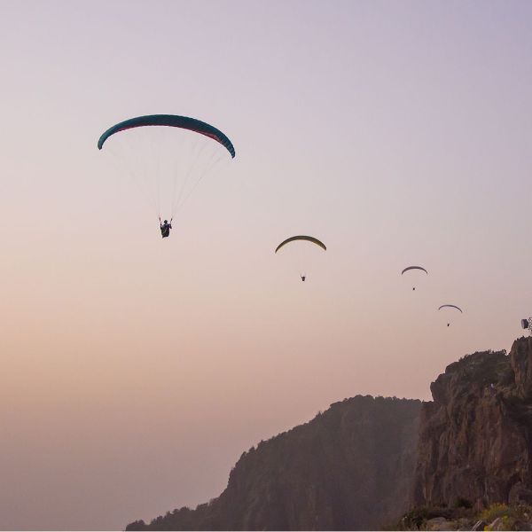 paragliding over a scenic mountain